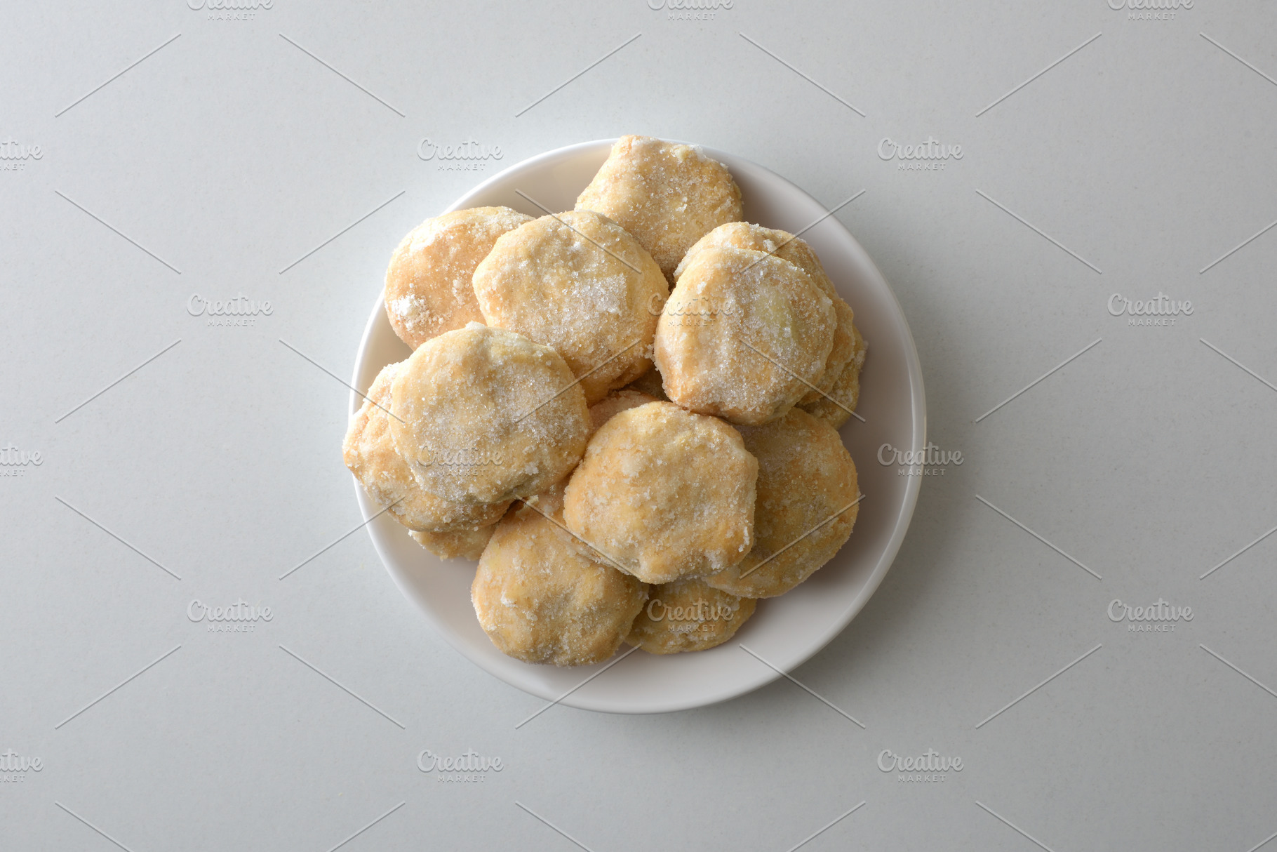 Stack of sugar cookies on plate isolated in the center, a Food & Drink Photo by Davizro's Market