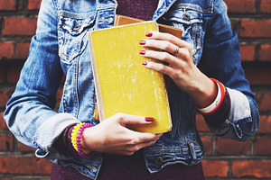 Student with books featuring student, books, and girl