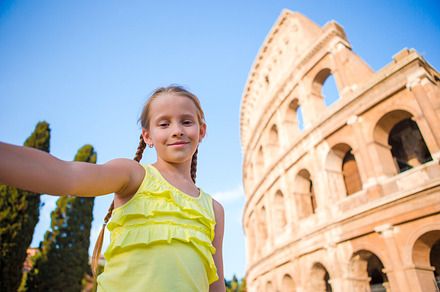 Little girl making selfie background coliseum rome italy kid portrait at, a Person Photo by travnikovstudio