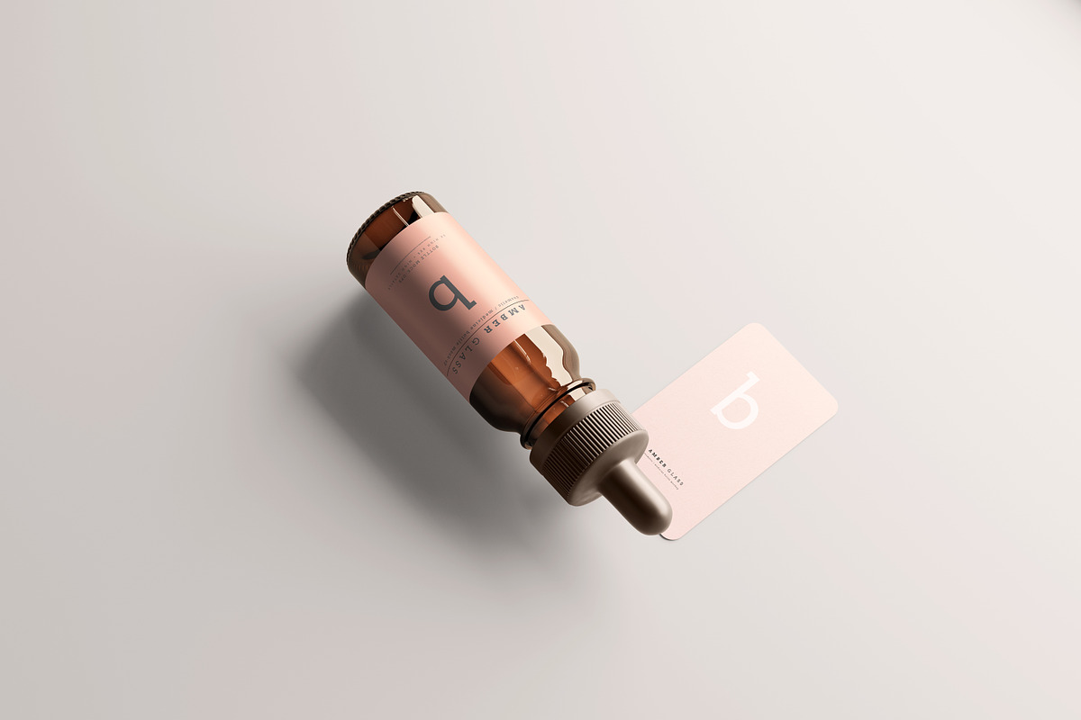 Amber Glass Dropper Bottle Mockups, a Cups & Container Mockup by pmvch (Photo 9 of 20)