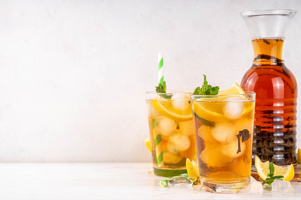 Iced tea cocktail drink, cold summer drink with black tea, a Food & Drink Photo by Rimma