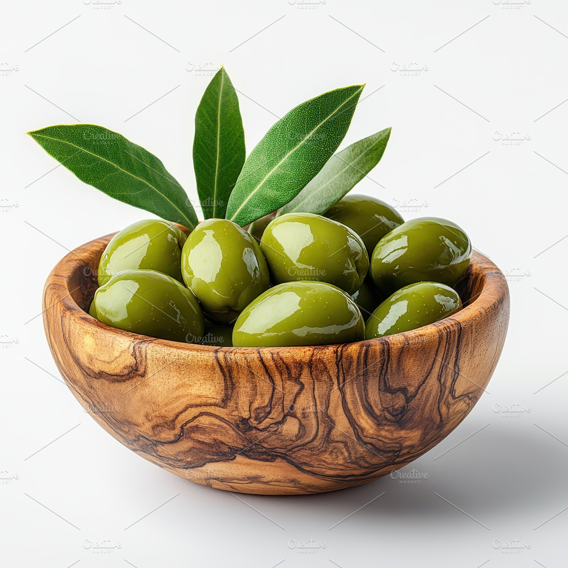 Green olives in wooden bowl with lea, a Food & Drink Photo by Pixeness Studio