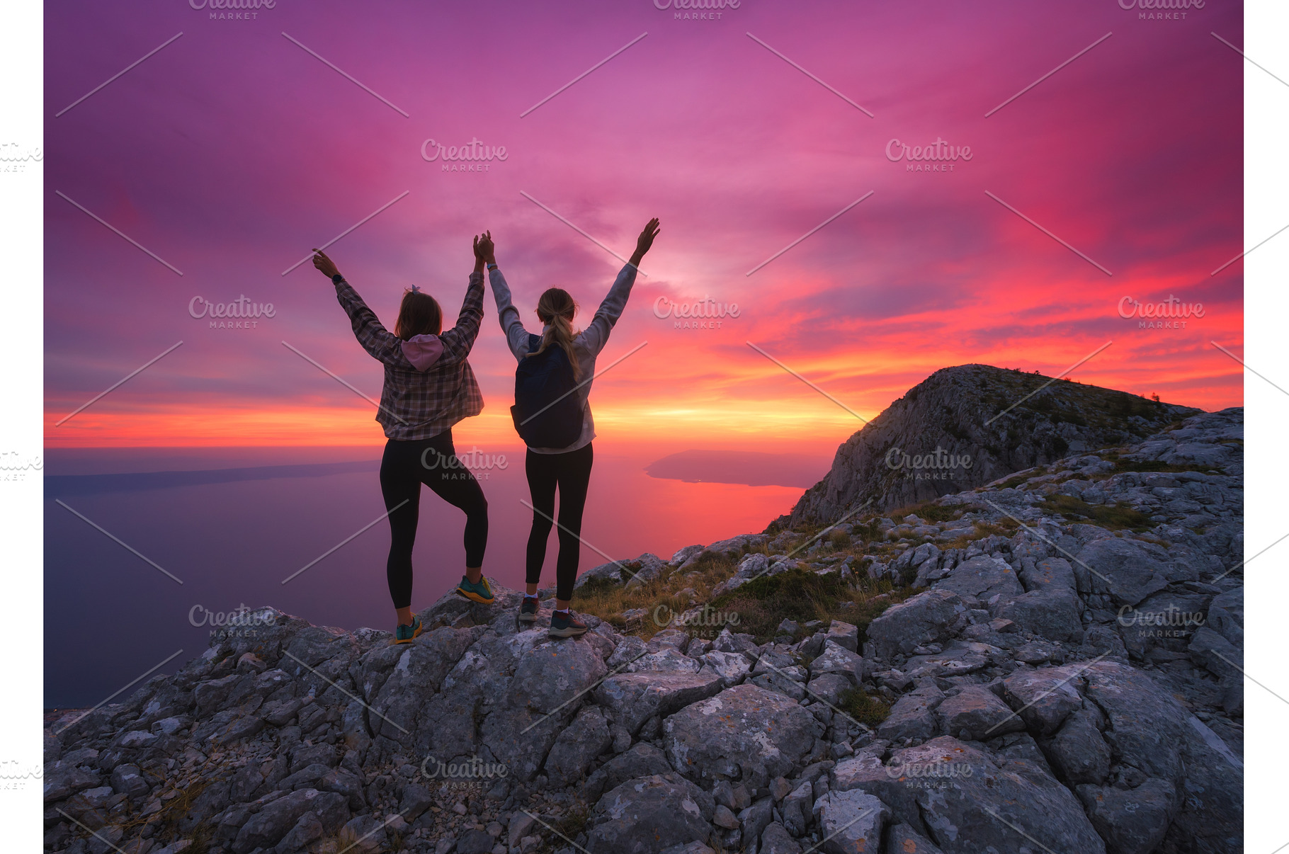 Two women with backpacks and raising, a Nature Photo by den-belitsky