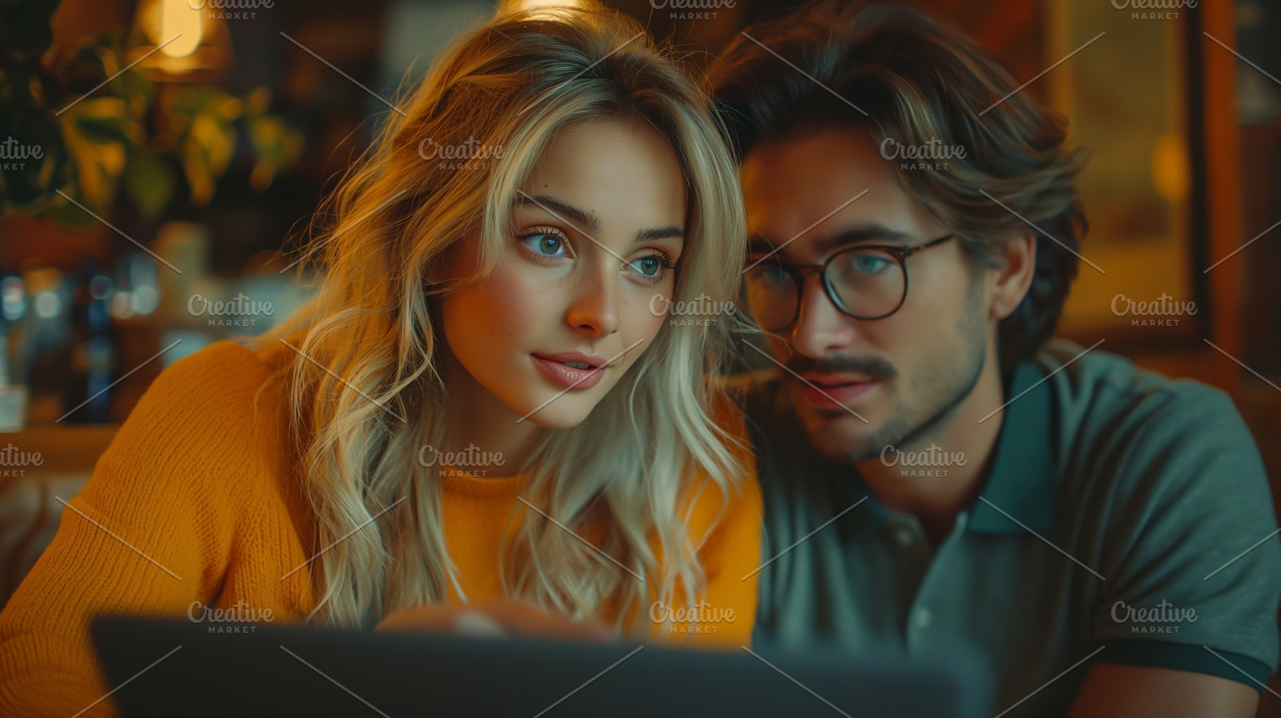 A young Caucasian couple, focused and engaged, reviews work together while seat, a Person Photo by ImageMir