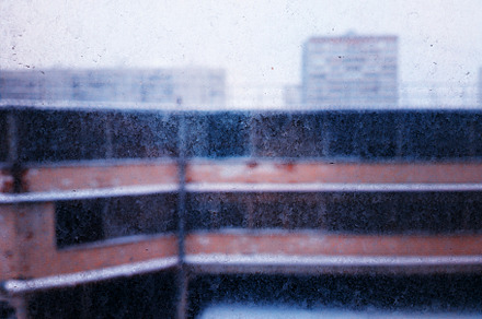 Abstract dirty window with geometrical architecture backdrop