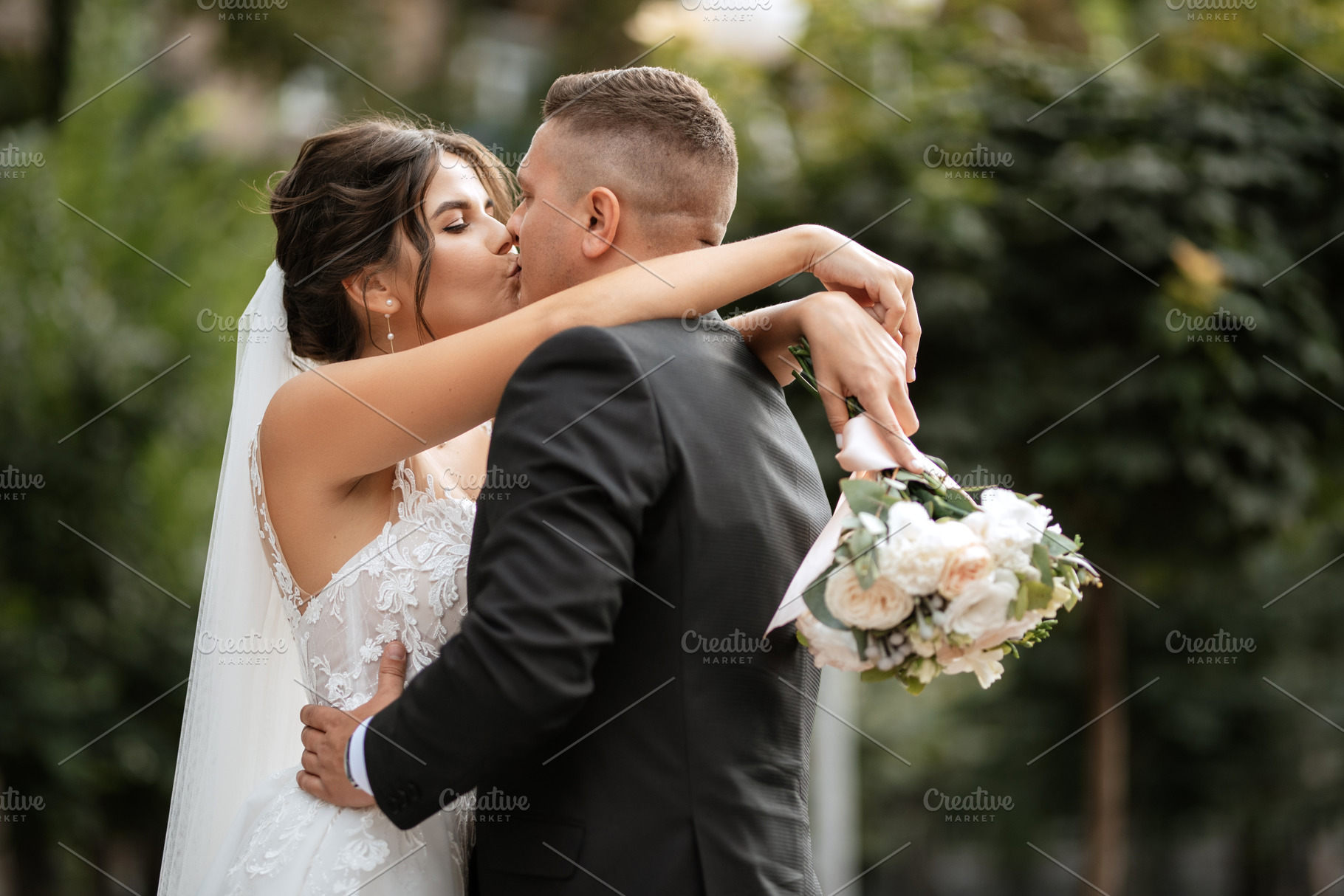 the groom in a brown suit and the bride in a white dress, a Person Photo by Weddings, People, Travel