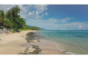 Tourists relaxing on tropical beach, a Nature Photo by Goinyk