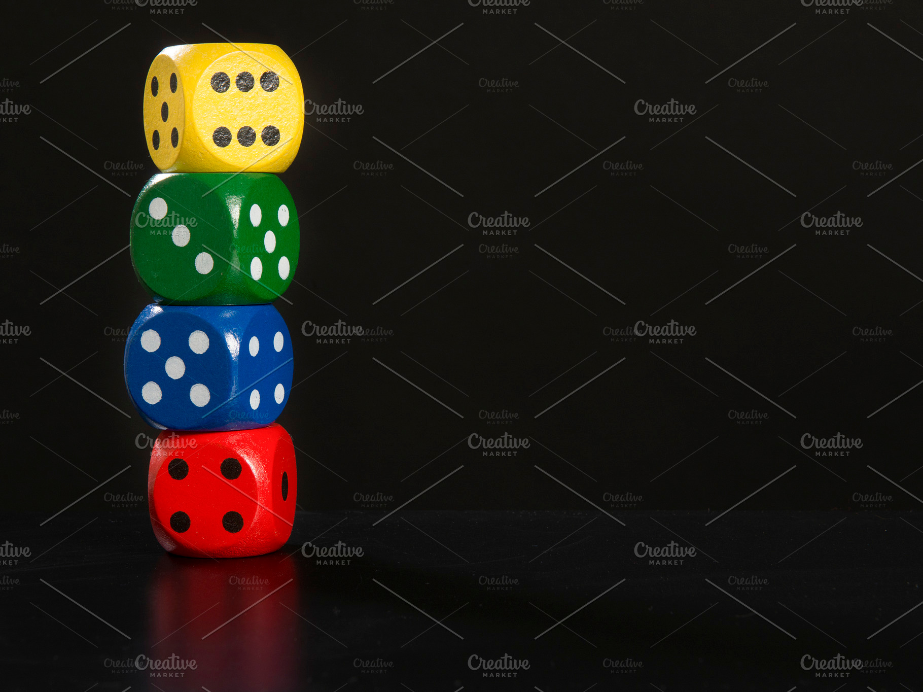 Colorful gaming dices stacked on a b, an Arts & Entertainment Photo by Elles Rijsdijk