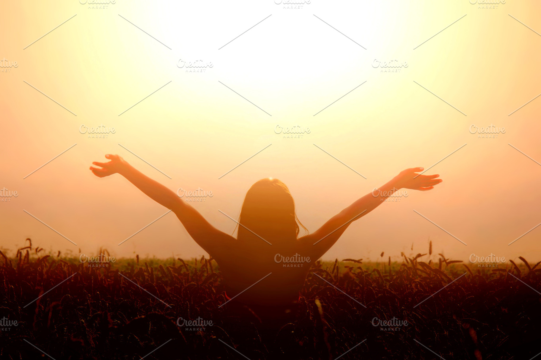 Happy girl lift her hands to the sky, a Person Photo by Milosz Aniol