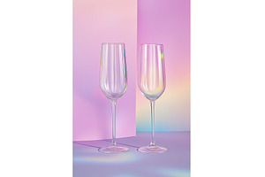 Two Champagne Flutes on a Vibrant, a Food & Drink Photo by Lermont51