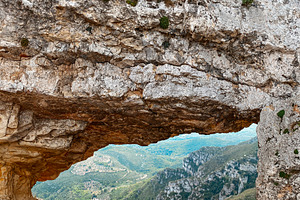 view of La Foradada rock arch in Serra del Montsia, a Photo by Nito