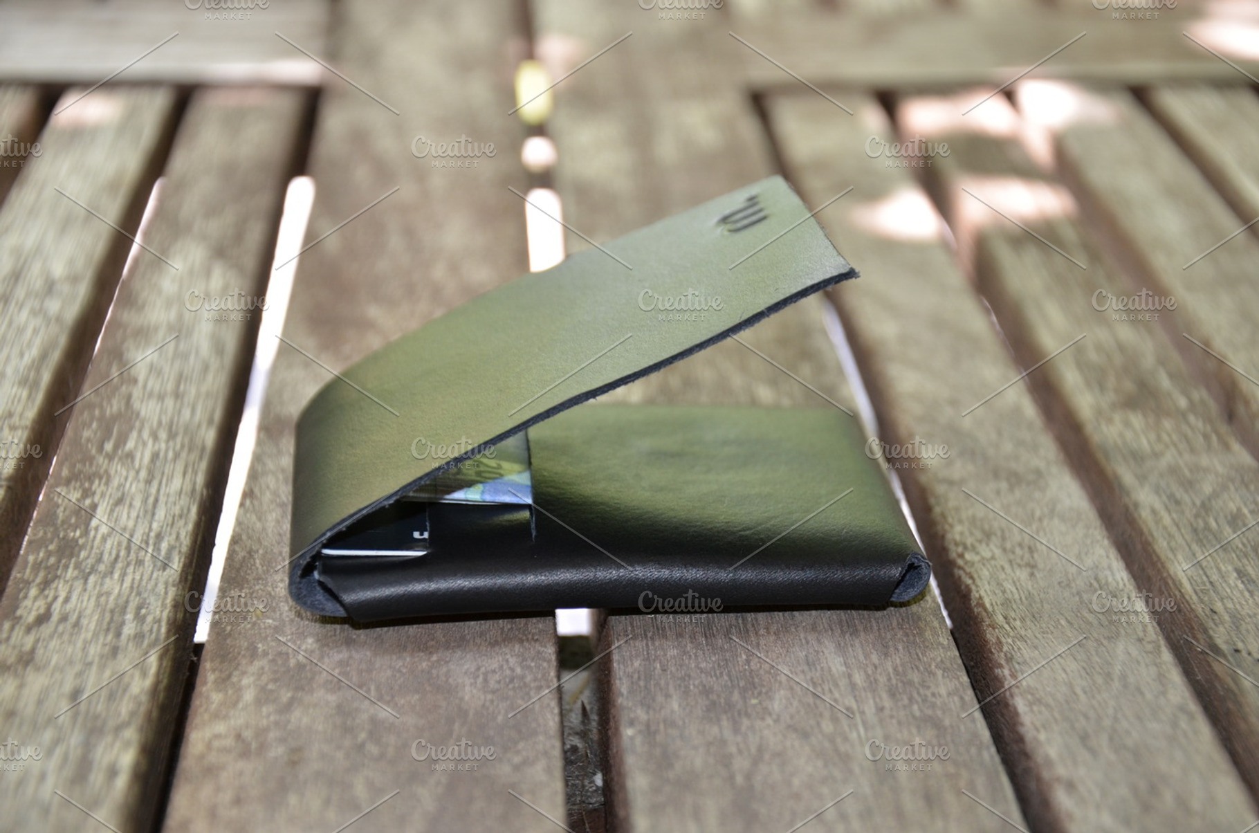 Leather wallet with money containing leather, fashion, and design