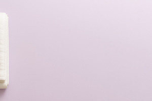 White folded blanket on pastel backg, a Photo by Dvoevnore photos