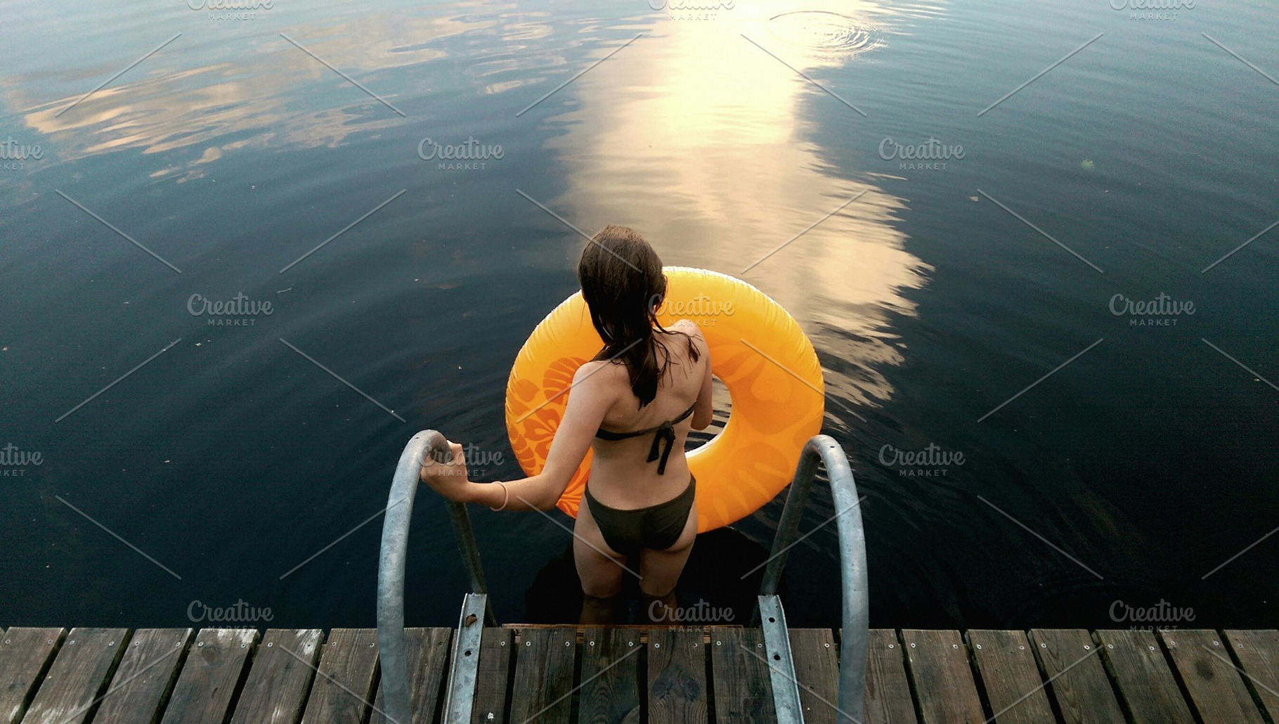 Girl with water wheel ready to swim, a Person Photo by BOOCYS