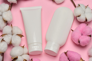 White plastic tube for cosmetics or cream on a pink background w, a Beauty & Fashion Photo by ndanko