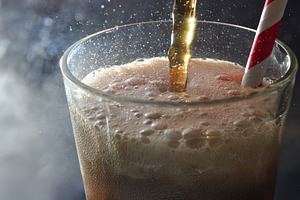 Detail of glass cup filled with refreshing drink dark background, a Food & Drink Photo by Davizro's Market