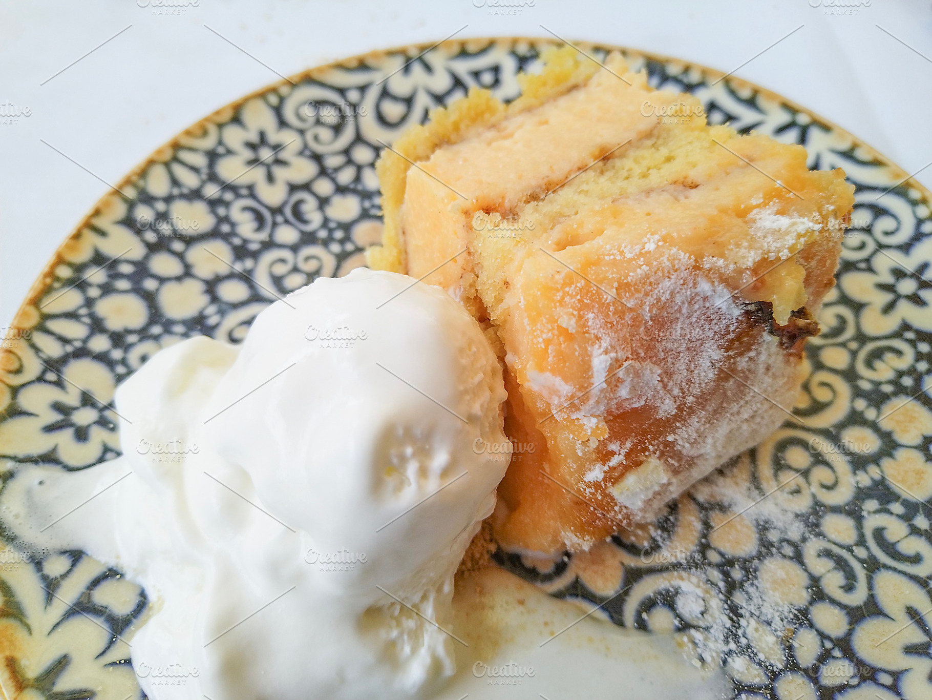 Sponge cake with vanilla ice cream on ceramic plate, a Food & Drink Photo by DanFLCreativo