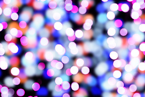 A blurred black background with bright circular bokeh lights in, a Background Photo by ndanko