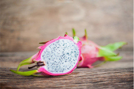 Healthy dragon fruits on old wooden, a Food & Drink Photo by Elizaveta Galitskaya