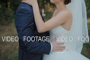 Bride And Groom Pose In The Wood