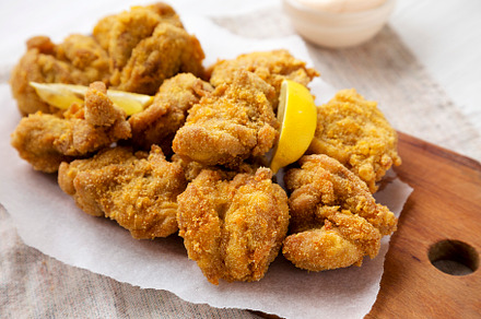 Homemade traditional japanese fried chicken Karaage on a rustic, a Food & Drink Photo by LiudmylaChuhunova