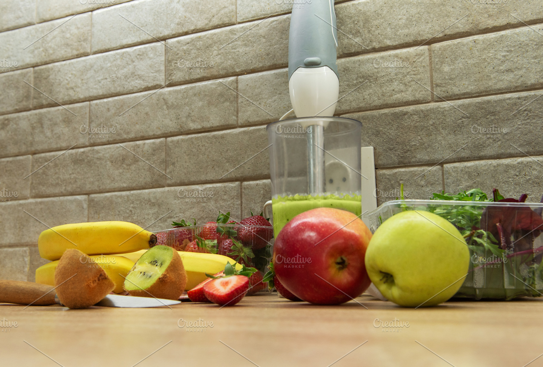 Preparing a healthy green smoothie with fresh fruits, a Food & Drink Photo by Olena Rudo