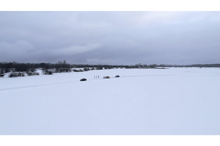 Bending winter ice track and driving, a Nature Photo by Media Whale Stock