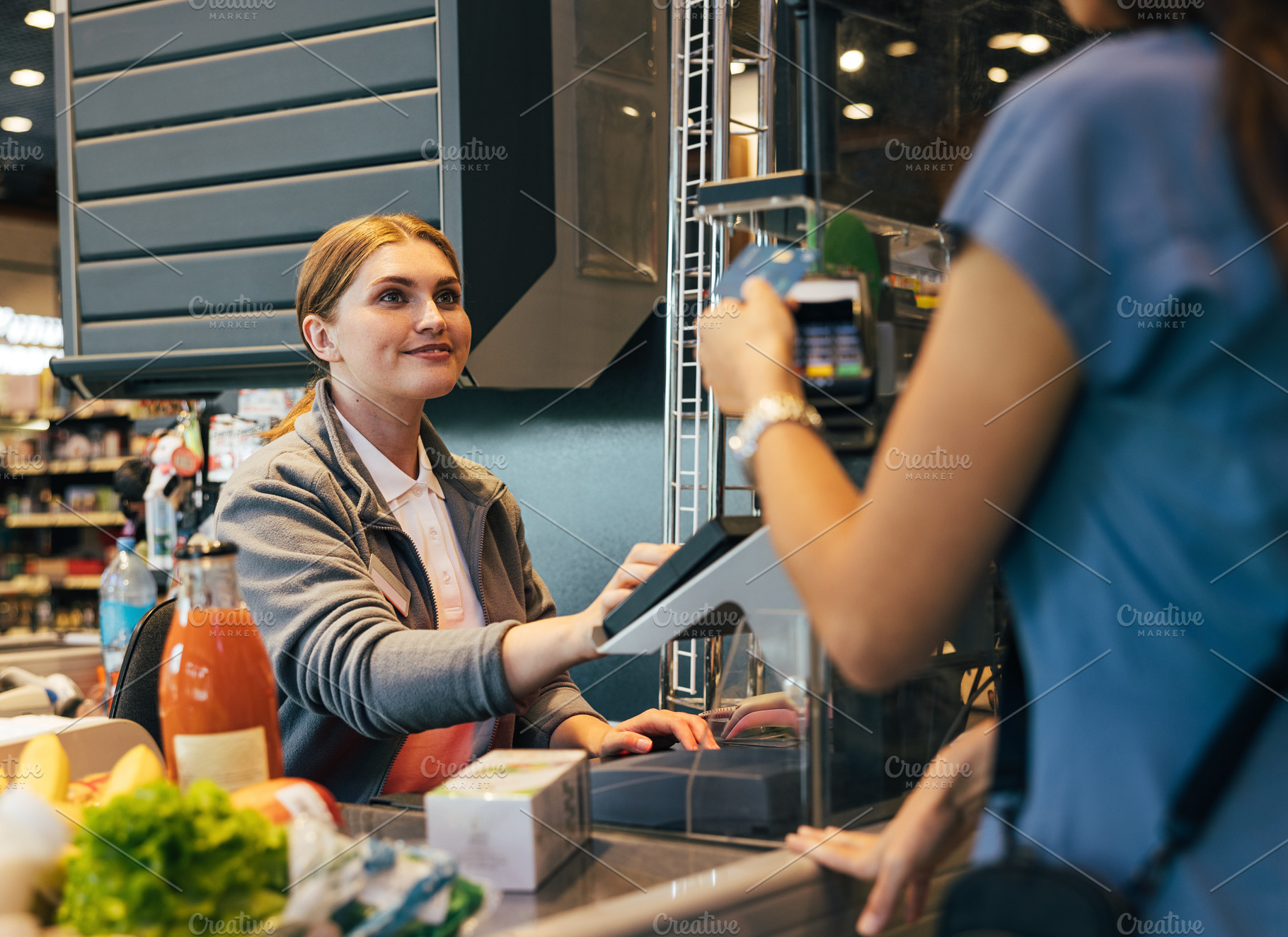 Smiling female cashier, a Person Photo by Artem Varnitsin