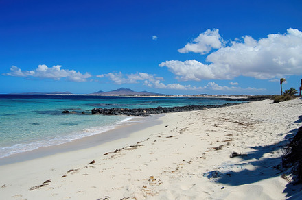 Beautiful sandy beach with crystal c, a Photo by Tanuart