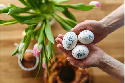 Hands holding decorated Easter eggs, a Holiday Photo by HalfPoint