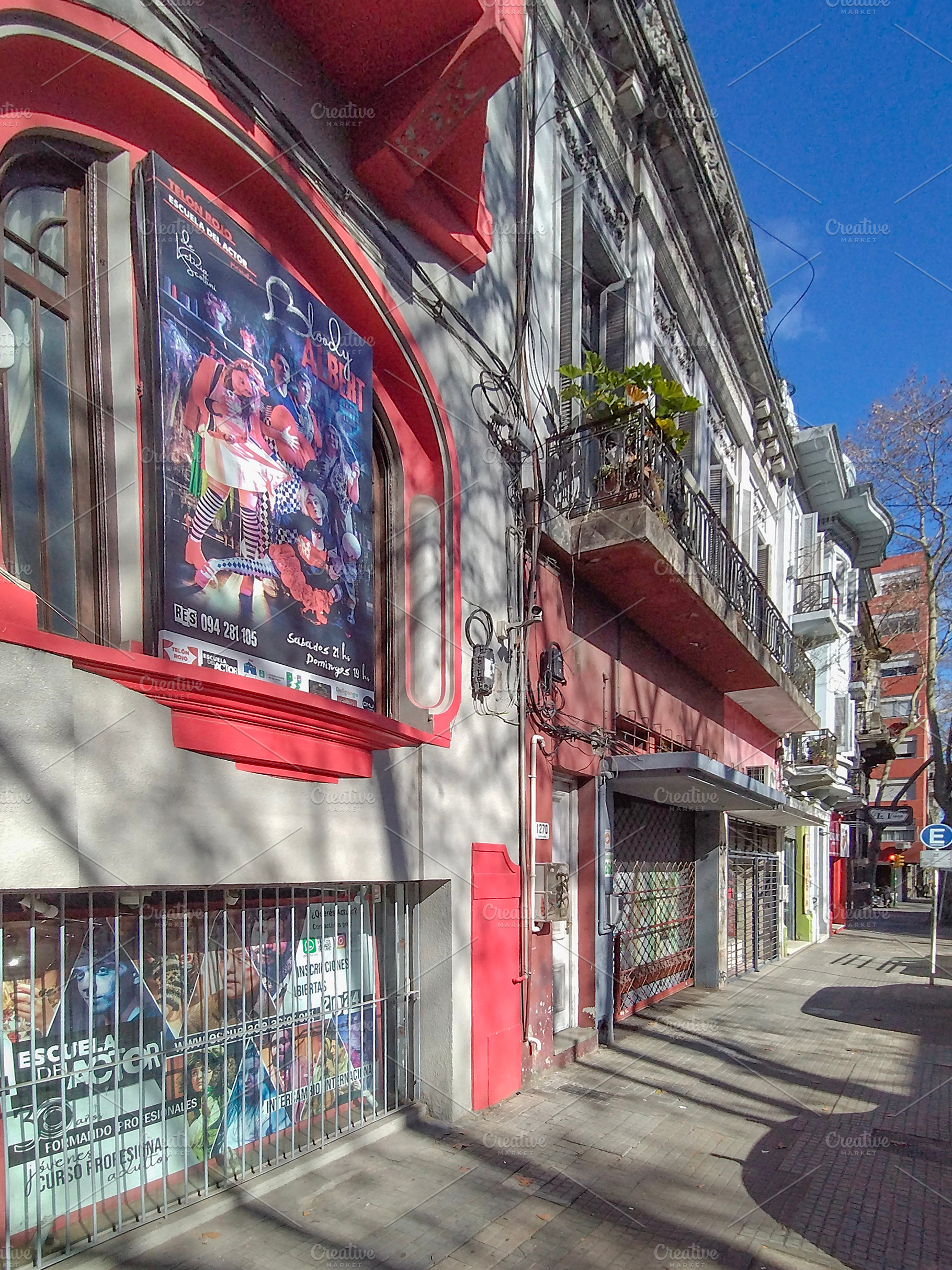 Colorful city street with vivid murals and graffiti on building, an Architecture Photo by DanFLCreativo