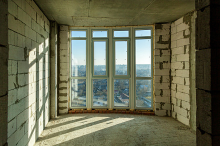 Empty rooms in a house under construction, an Industrial Photo by Photostock