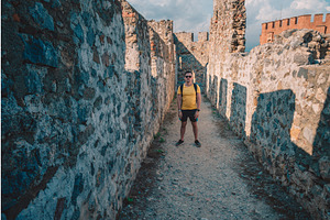Man at fortress ruins of the, a Graphic by Jan Jack Russo Media