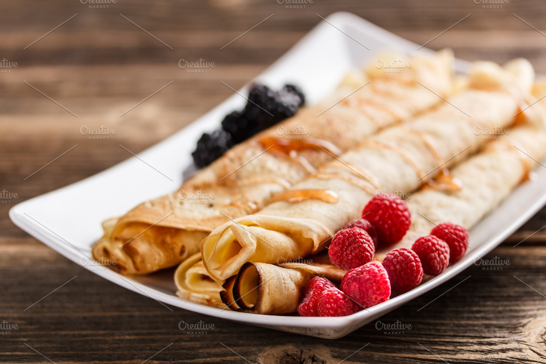 Roll pancakes stock photo containing berries and blackberry