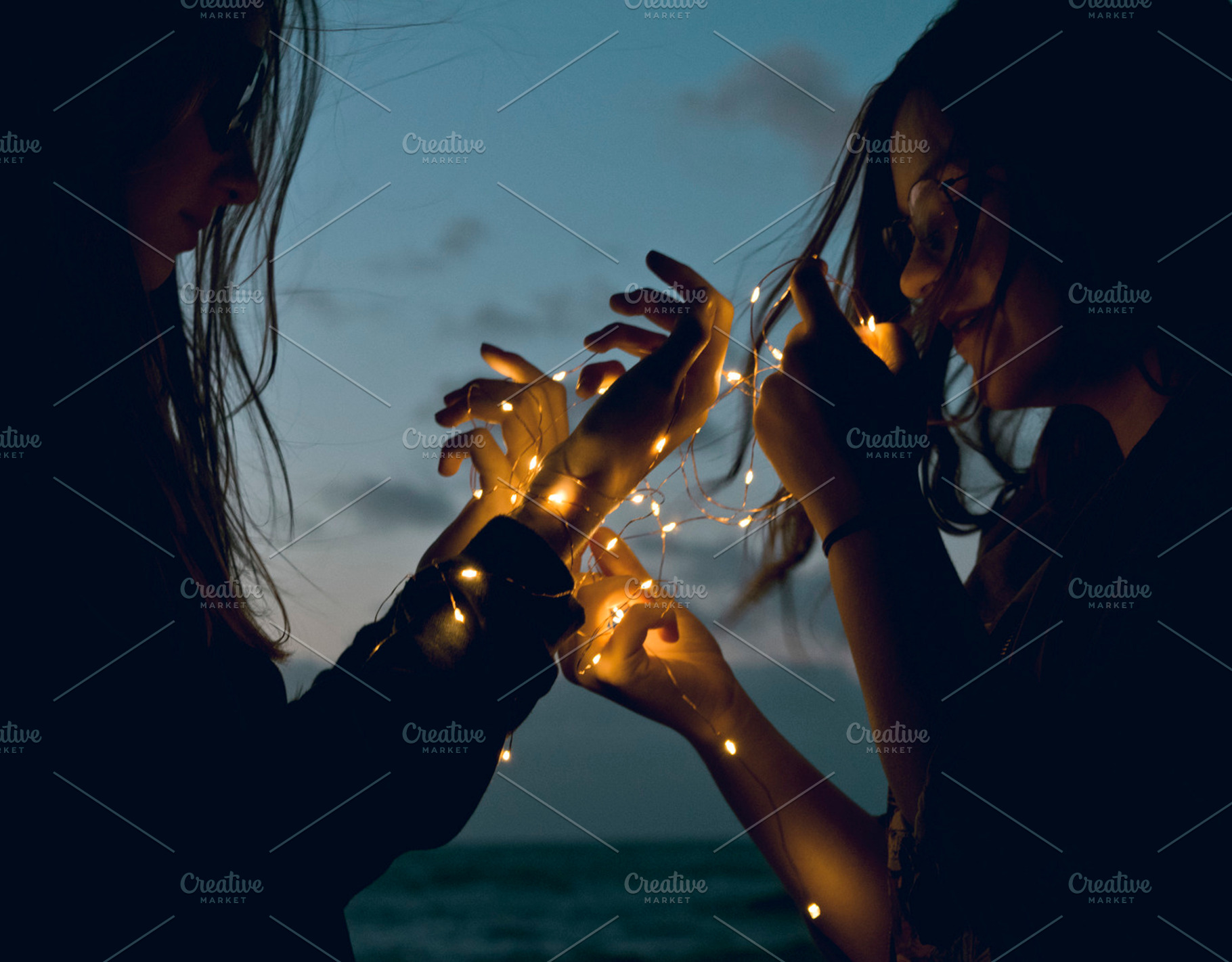 Two girls holding lights, a Person Photo by Fossilized Tree Sap