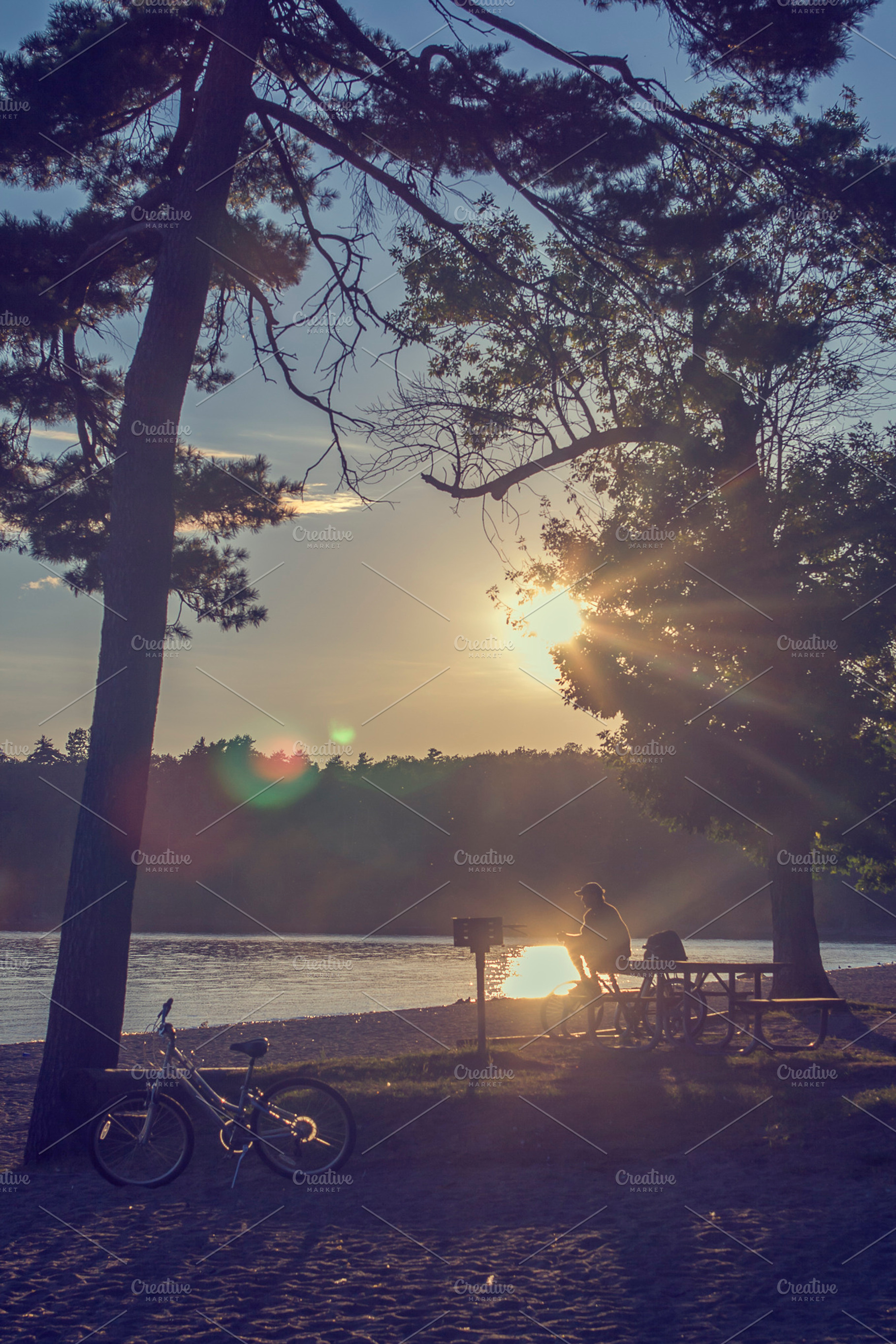 Man Near A Lake At Sunset
