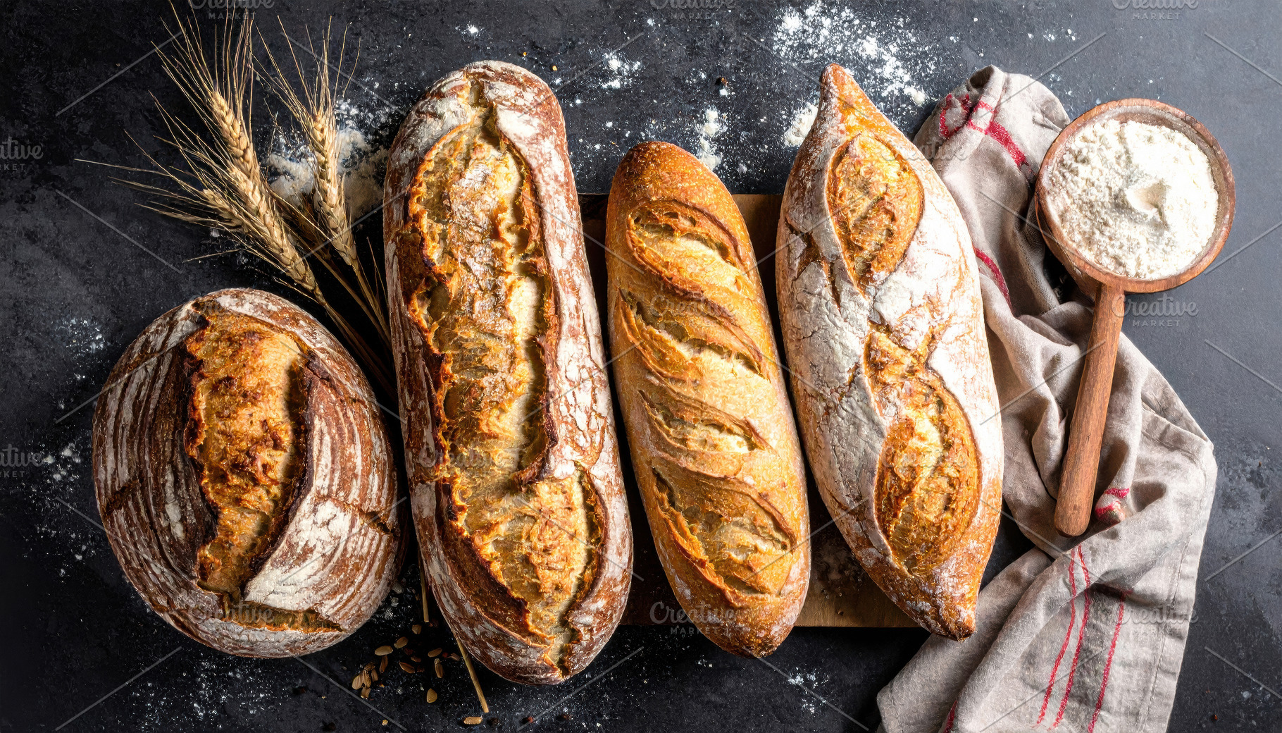 Artisan Sourdough Loaves on Rustic Dark Table, a Food & Drink Photo by Davizro's Market