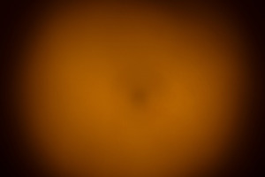Soft, warm brown gradient background with subtle vignette effect, a Background Photo by Ales Munt