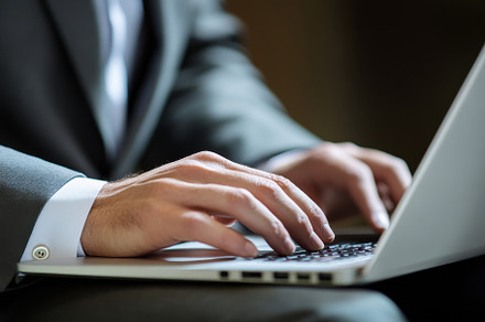 Close up of businessman using laptop, a Photo by Iftikhar Alam