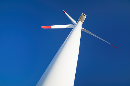 Wind turbine over blue sky