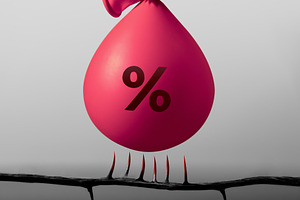 Water filled Balloon labeled Percentage dangerously above spikes, a Photo by salmon.black