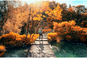 Woman with backpack walking on, a Nature Photo by den-belitsky