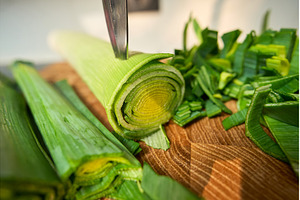 A person is cutting leeks on a, a Food & Drink Photo by darksoul72