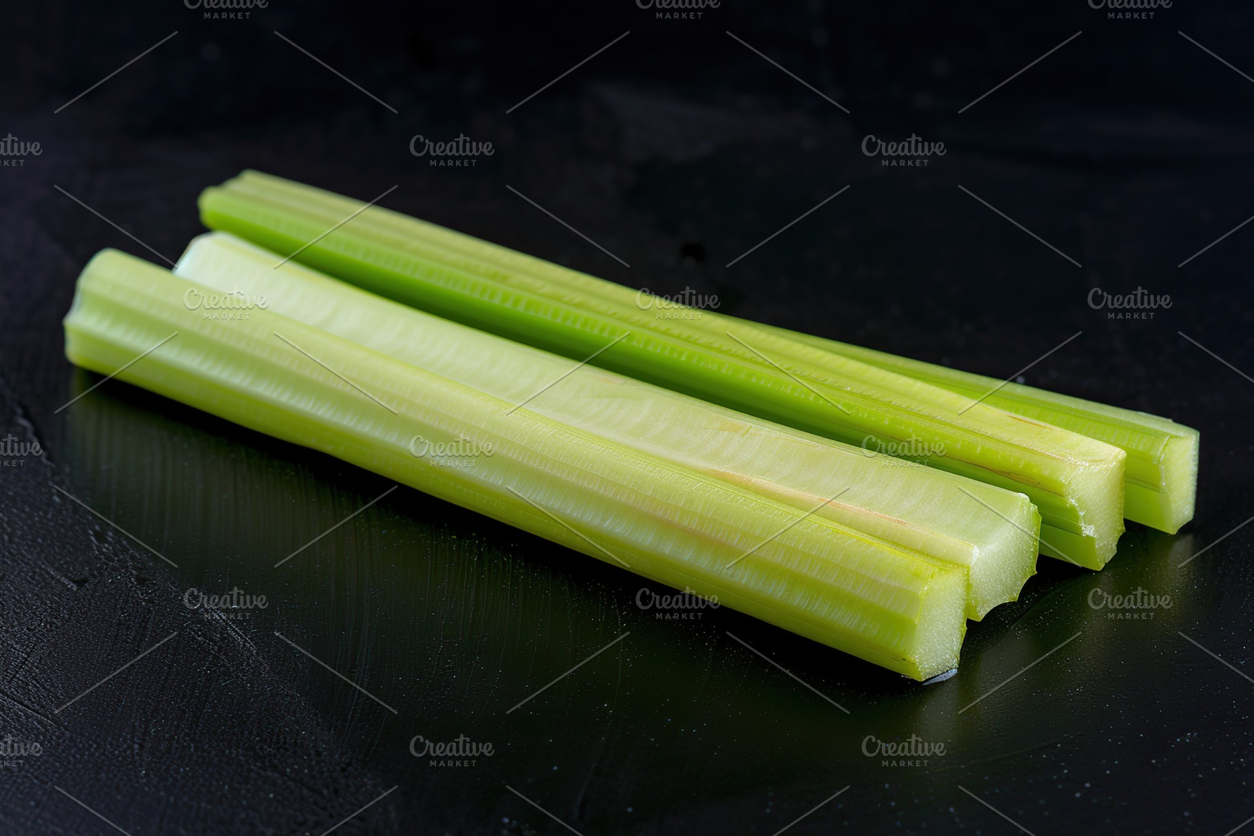 Green fresh celery sticks on black background, a Food & Drink Photo by AlyaAnd