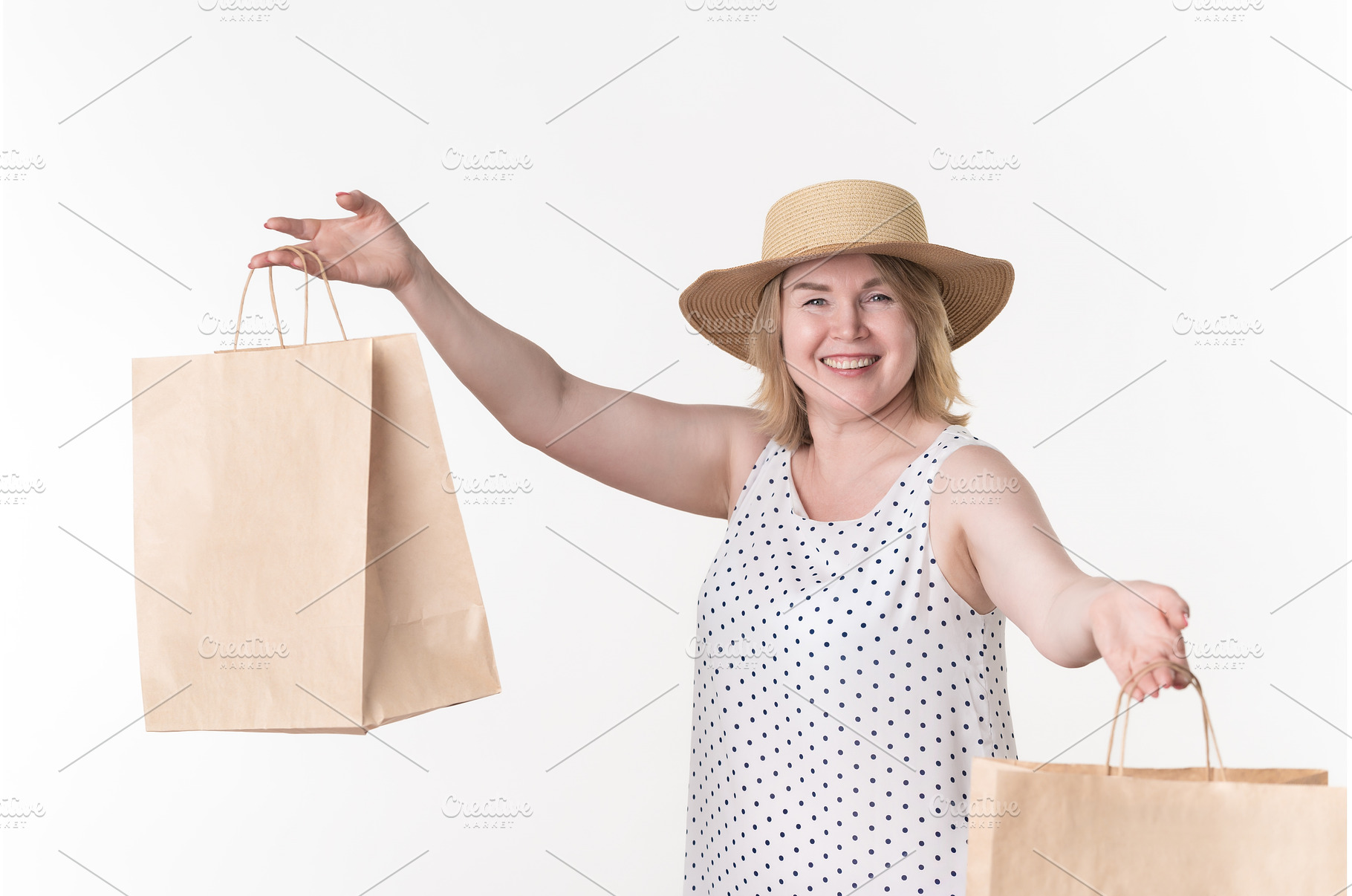 Woman shopper in white dress holds, a Person Photo by Alexander-Piragis