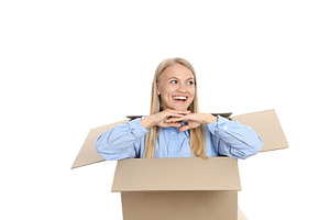Concept of delivery, young woman in box, isolated on white backg