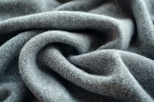 A close-up view of a soft gray fabric, showcasing its elegant texture and intri, a Background Photo by ImageMir
