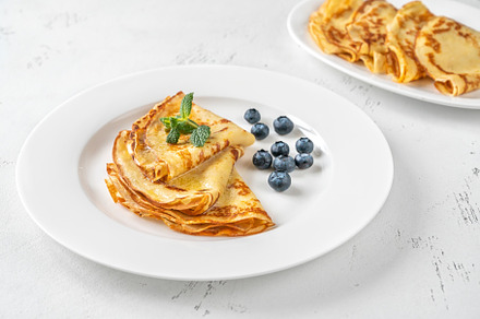 Folded crepes on the plate, a Food & Drink Photo by Alexander Prokopenko
