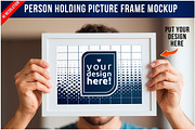 Person Holding Picture Frame PSD, a Product Mockup by Bruno's Shop (Thumbnail 1 of 3)