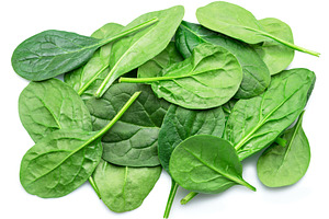 Spinach leaves isolated on white, a Food & Drink Photo by Volff